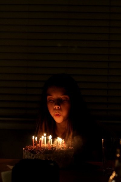 blowing birthday candles out