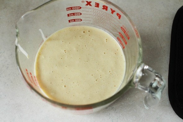popover batter in measuring cup for easy pouring