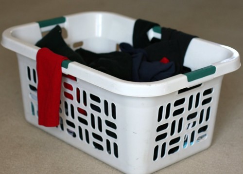 A laundry basket full of clothes.