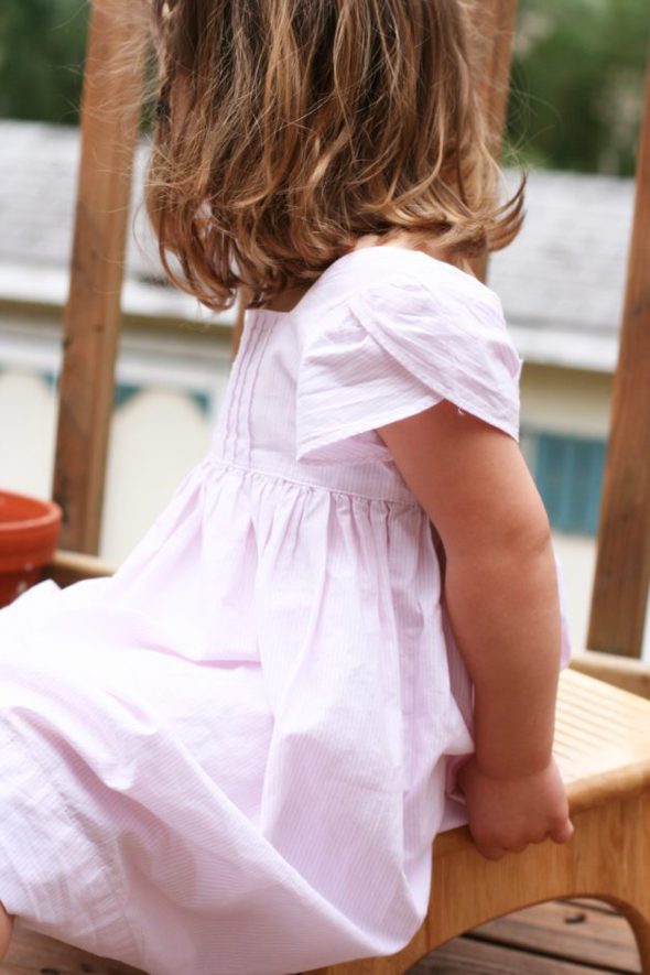 Preschool girl in pink Ralph Lauren dress.