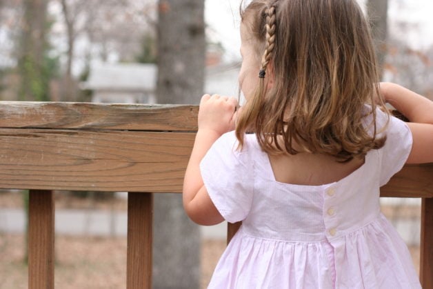 Zoe wearing a pink Ralph Lauren dress.