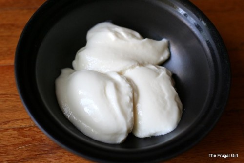 Homemade yogurt spooned into a bowl
