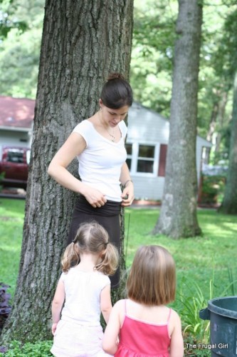 Kristen with two preschoolers standing near her.