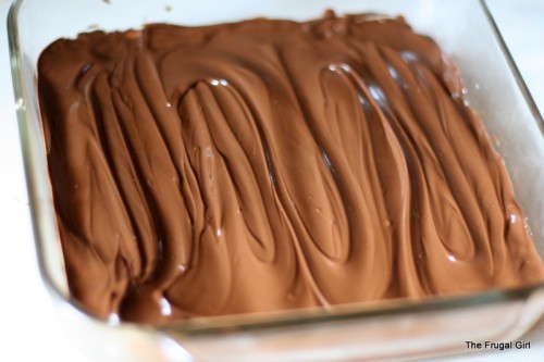 A square pan of desser topped with chocolate frosting