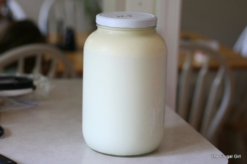 A large glass Mason jar full of milk.