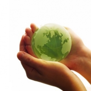 A green earth held in two hands.