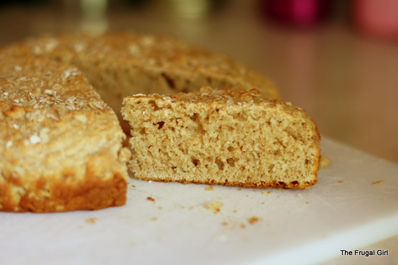 A round loaf of bread, cut into wedges.