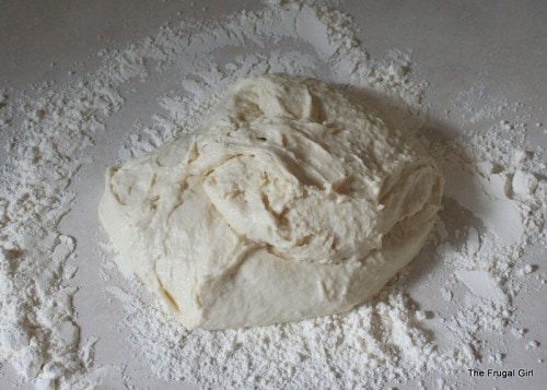 Bread dough on a floured counter.