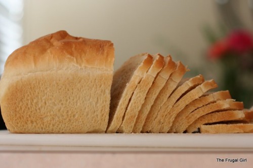 A sliced loaf of homemade sandwich bread.
