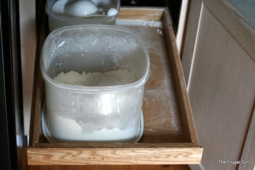 A bin of flour in a drawer.
