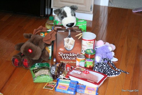 Groceries arranged on the floor.