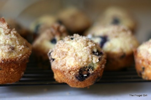 Blueberry muffins on a cooling rack.