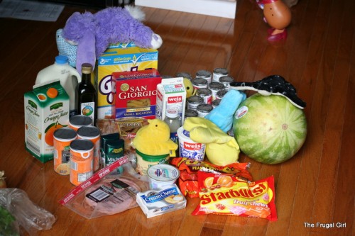 Groceries arranged on the floor.