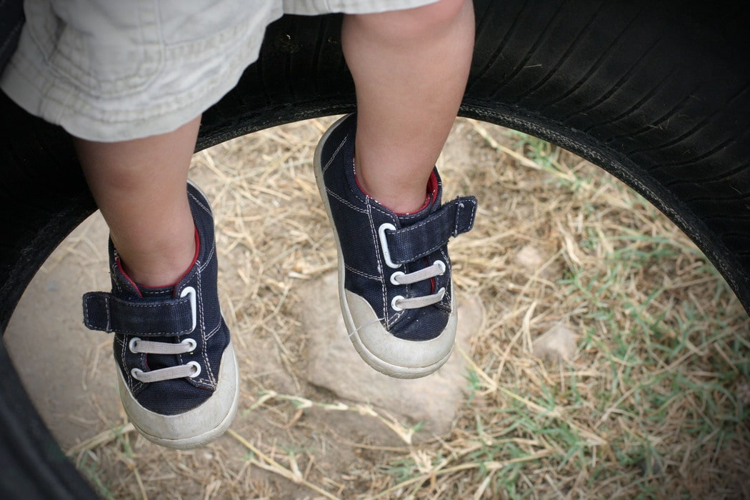 A toddler's navy blue shoes.