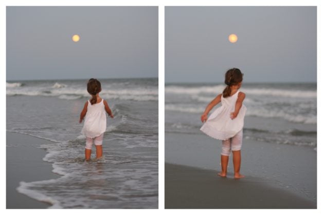 Zoe in a little white dress on the beach.