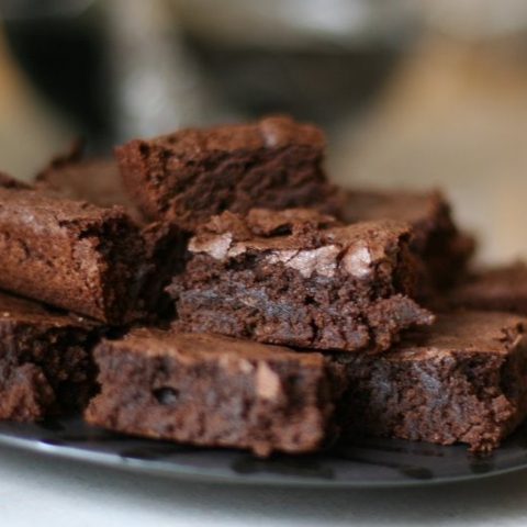 homemade brownies on a plate.