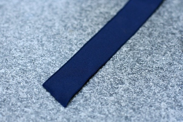 Navy blue ribbon piece.