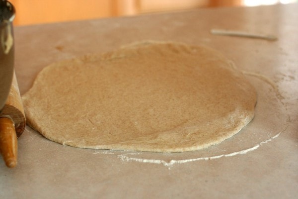 Yeast dough rolled out into a square.