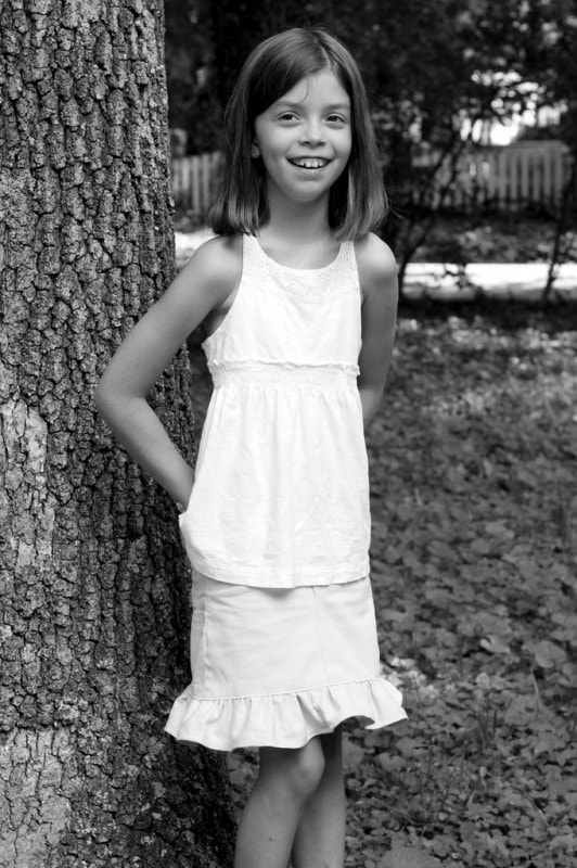 A girl wearing a ruffled skirt.