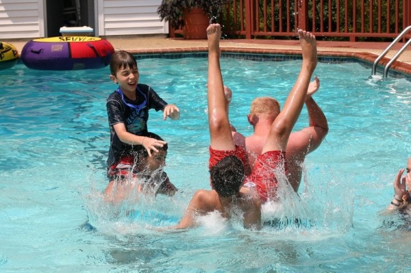 Children playing in a swimming pool.