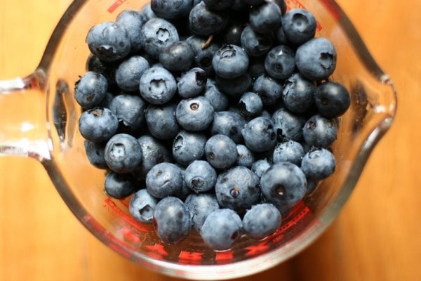 Blueberries in a measuring cup.