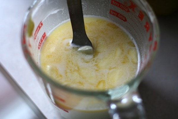 Melted butter in a pyrex measuring cup.