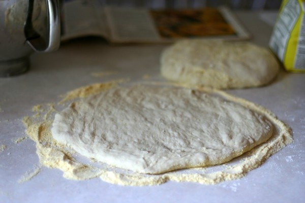 Rolled-out bread dough on a counter.