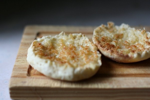 A toasted and buttered English muffin.