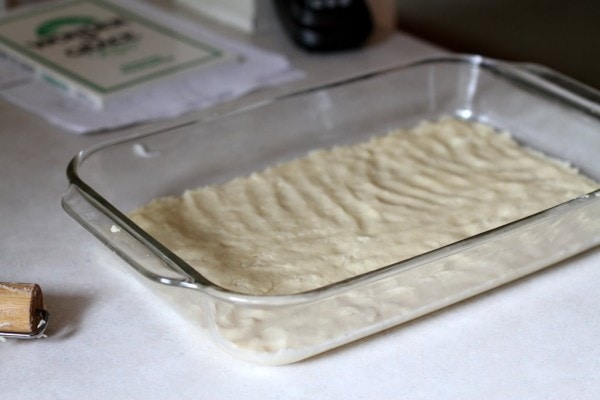 Shortbread crust in a glass 9x13 pan.