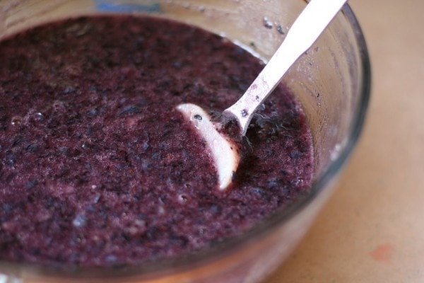 Blueberry jam in a glass bowl.