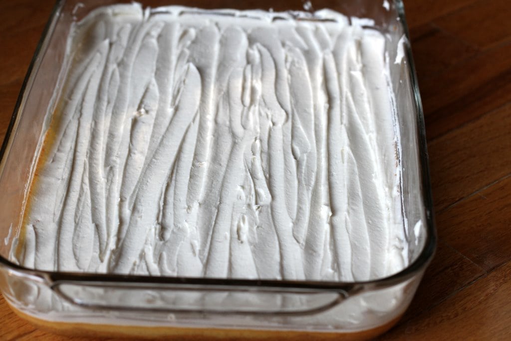 A frosted 9x13 pan of bars.