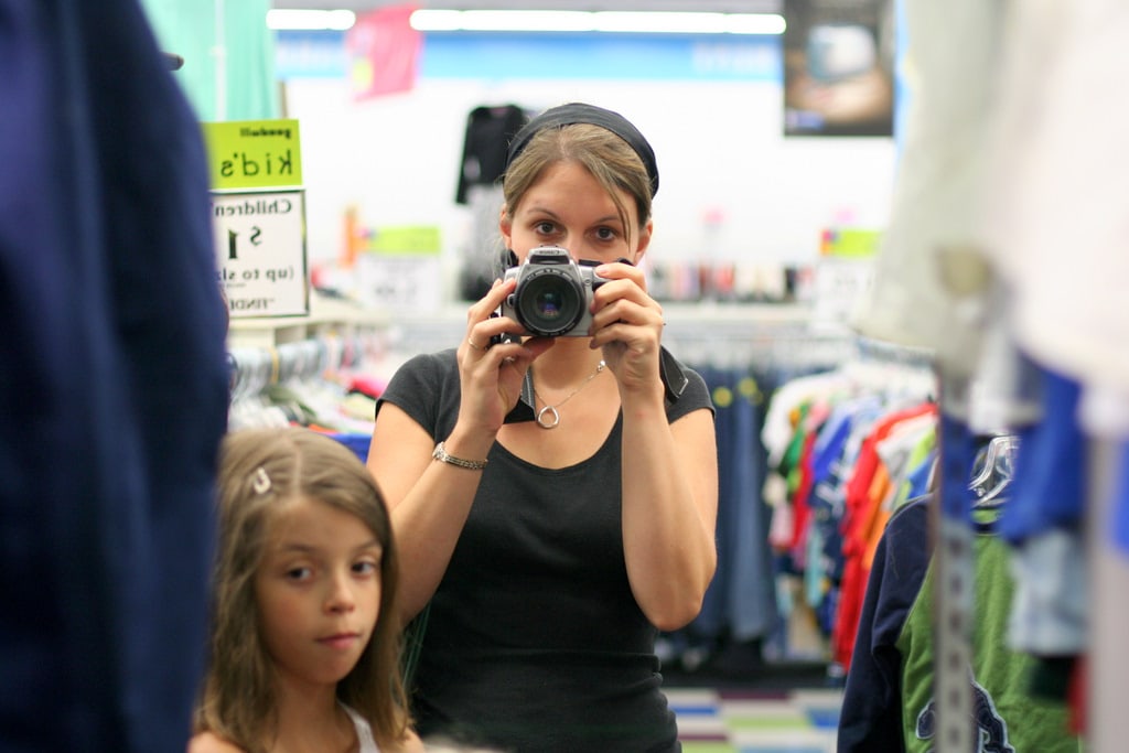 Kristen taking a photo of herself in a mirror.