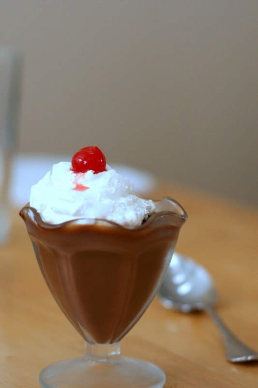 Chocolate pudding in a parfait glass.