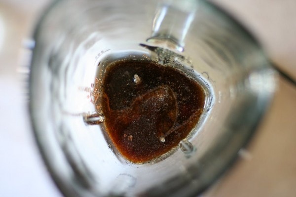 Overhead view of soy sauce in a blender jar.