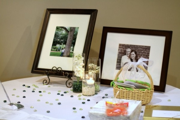 A wedding guest book table with framed photographs.