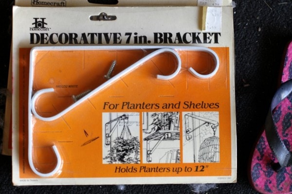 A vintage package of hanging brackets from Caldor.