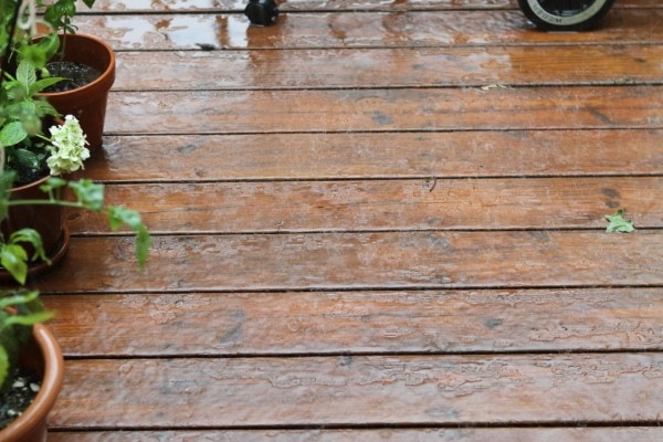Rain falling on deck boards.