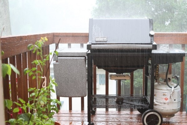 Rain falling on a Weber grill.