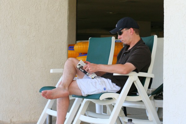 Mr. FG reading by the pool.