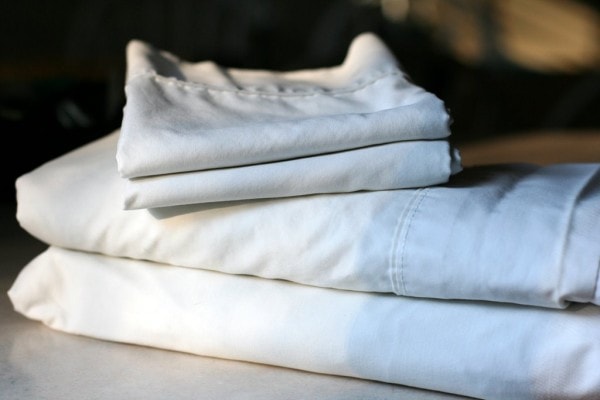 A set of white sheets, folded.