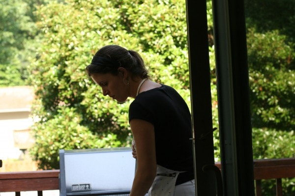 Kristen sweeping up the deck.