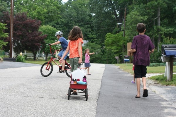 Children walking down a road.