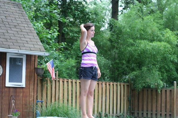 Kristen hesitating to jump off a diving board.