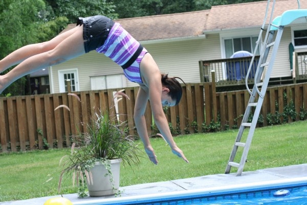 Kristen diving into a pool