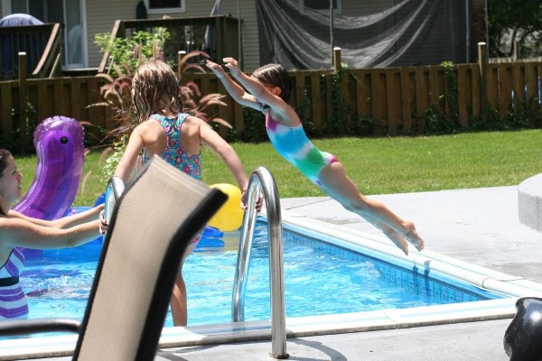 Kristen with kids in the pool.