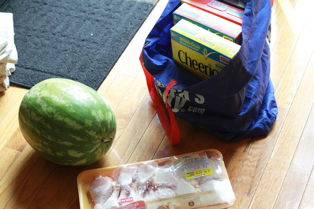 Groceries on a wooden floor.