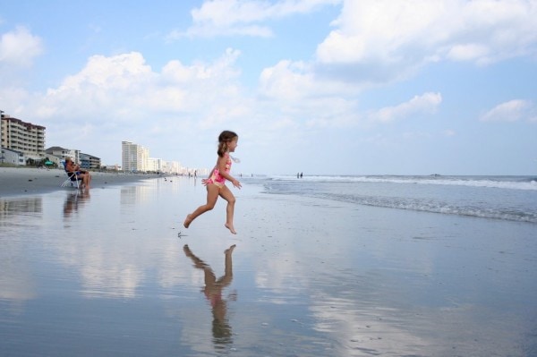 Zoe running toward the waves.