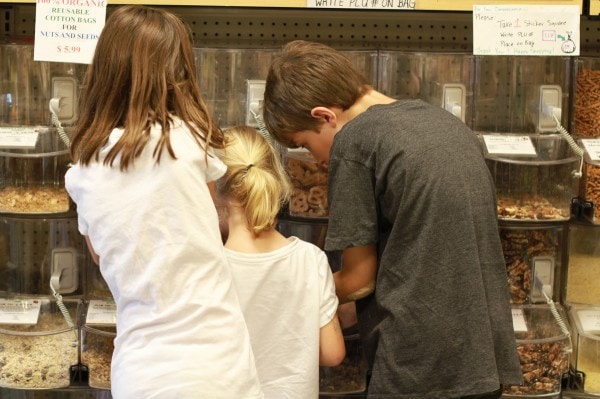Kids picking lollipops from the bulk food bins.