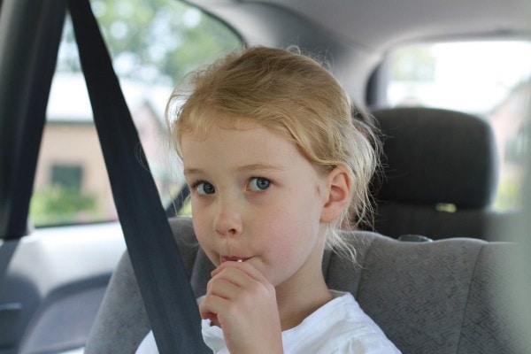 Sonia sucking on a lollipop.