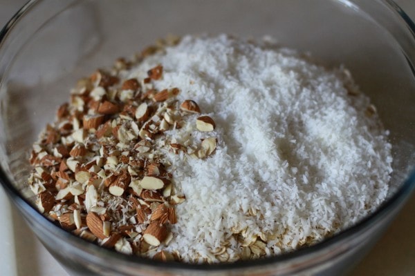 Granola ingredients in a glass bowl.